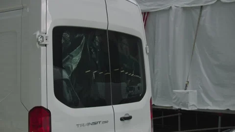 Still shot of van and back windshield reflection of city scene and lights Stock Footage 251198977