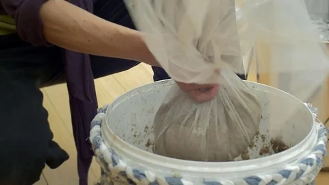 Still shot wringing paper pulp Stock Footage 76850197