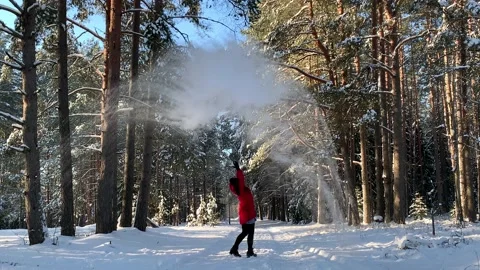 Still Slow motion: beautiful red coat girl throws hot water in cold air, Vídeos de archivo 146907358