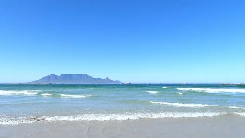 Still Table Mountain from Blouberg beach with seagull flying by Stock Footage 176739021