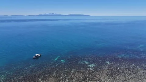 Still Video - Overhead Angled Boat over Reef Stock Footage 293191986