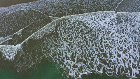 Still video, showing the abstract forms of waves running into shore Stock Footage 169957422