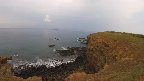 Still view of a bay look out to ocean horizon during gloomy day time at seashore Stock Footage 243000650