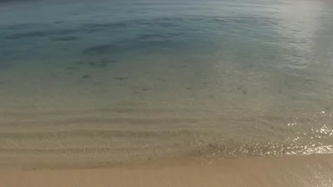 Still view of looking down to the beach sand over look to blue turquoise lagoon  Video stock 245444065