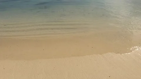 Still view of looking down to the beach sand over look to blue turquoise lagoon  Stock Footage 245444260