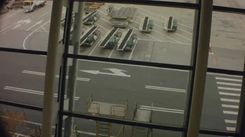 Still view looking out to the apron runway with traffic bus trucks road cranes Video stock 157967687
