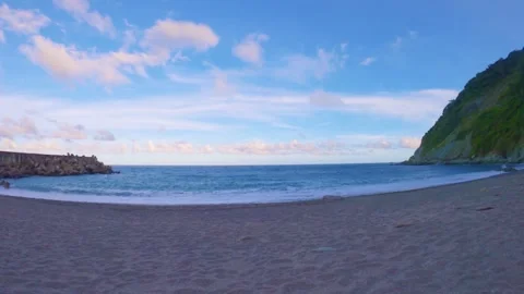 Still view of peaceful beach side with ocean sea salt water pounding lightly on  Stock Footage 263018188