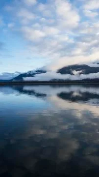 Still water with cloud reflections Stock Photos