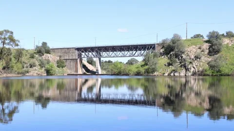 Still water reflecting the Tapada Dam in Lousal Stock-Footage 332359635