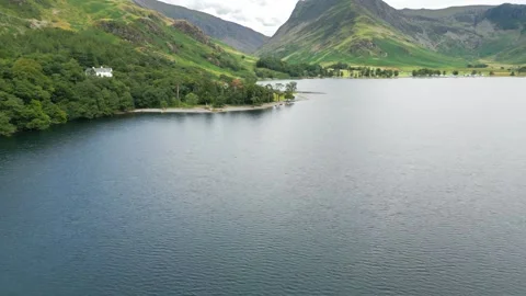 Still waters reflect towering, verdant hillsides Stock Footage 345524167