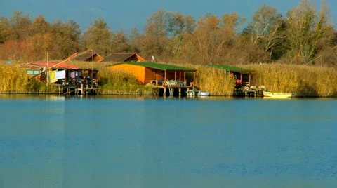 Stilts houses on the water with nets for fishing Stock Footage