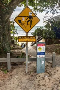 A stinger warning sign marks the entrance to Four Mile Beach in Port Douglas Stock Photos