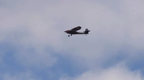 Stinson L-13 Grasshopper Flying Past Clouds Stock Footage 24135914