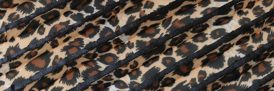 Stipes of fabric with leopard pattern close up. Stock Photos