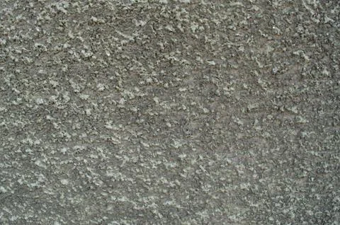 Stippled effect on plaster applied to a wall in dirty grey Stock Photos
