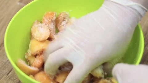 Stir the apricots with sugar Video stock 69993027