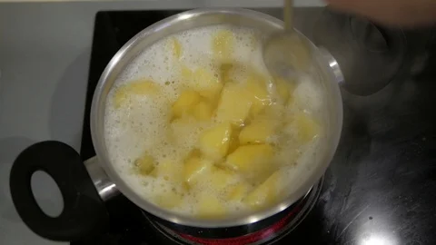 Stir boiled potatoes in a pan Stock Footage 98134595