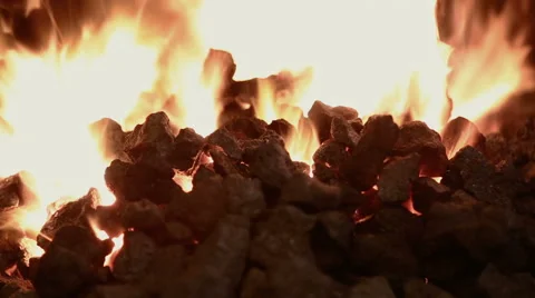 Stir the coals in the fire Stock Footage 67694600
