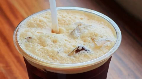 Stir coffee foam on the table. Stock Footage 305926954