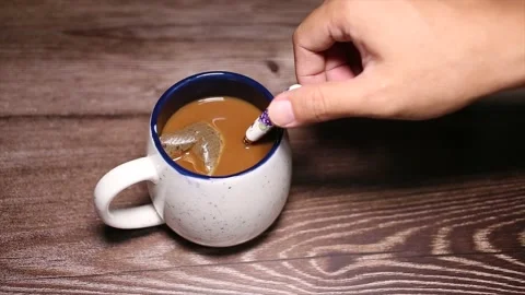 Stir a coffee in a glass Stock Footage 132533124