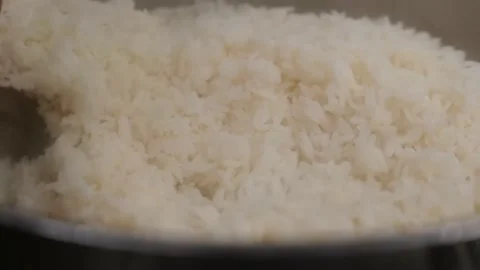 Stir cooked rice in a tray Stock Footage 171360688