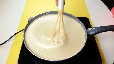 Stir custard in a pan Stock Footage 72507096
