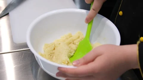 Stir eggs into dough hands unrecognizable child and mother holding iron spoons 스톡 동영상 285063570