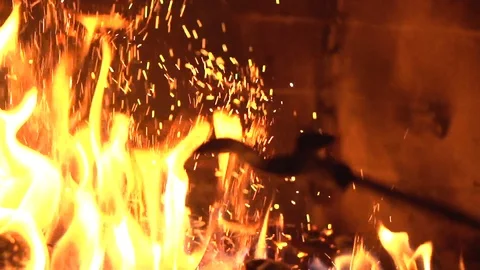 Stir in firewood. Fire in the fireplace. Video stock 119984046