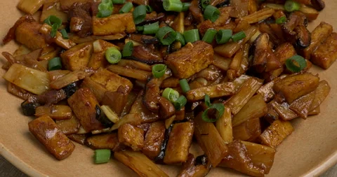 Stir fried bamboo shoots with mushrooms and tofu. Stock Footage 293221253