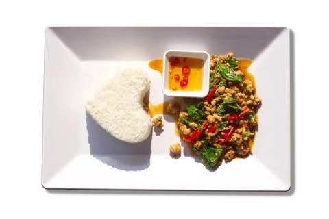 Stir fried basil leaf pork with rice on a white background. Stock Photos