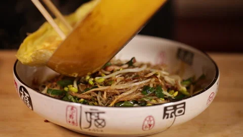 Stir fried bean sprouts and mixed vegetables in non stick pot (1) Stock Footage 202155975