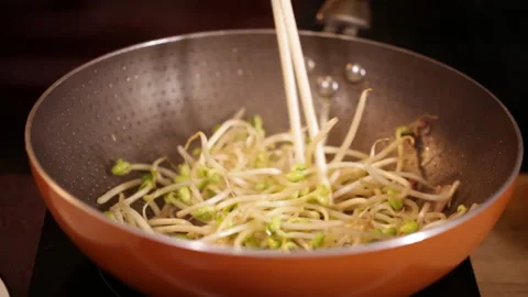 Stir fried bean sprouts and mixed vegetables in non stick pot (3) Stock Footage 202155990