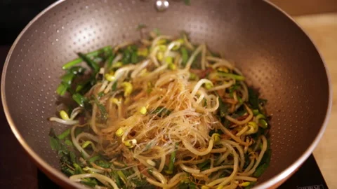 Stir fried bean sprouts and mixed vegetables in non stick pot (5) Stock Footage 202156037
