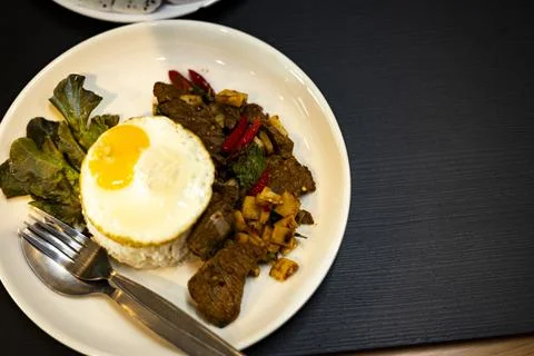 Stir Fried Beef With Chili Paste With Rice And Fried Egg Stock Photos
