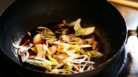 Stir-fried Beef with Leeks Stock Footage 128643775