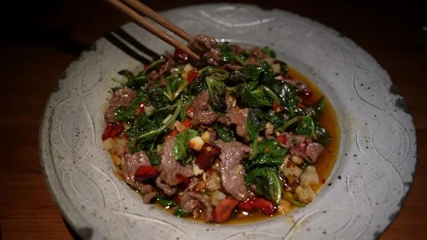 Stir-fried Beef with Mint Stock Footage 344514447