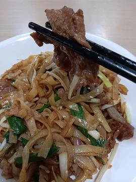 Stir fried beef with noodles made from rice flour Stock Photos
