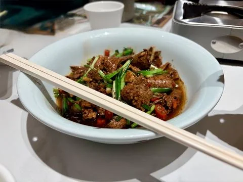 Stir-fried beef with vegetables in a savory sauce. Stock Photos