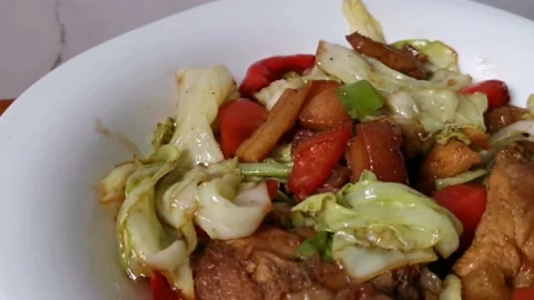 Stir Fried Cabbage Bellpepper Vegetables with Porkchops Stock Footage 235499377