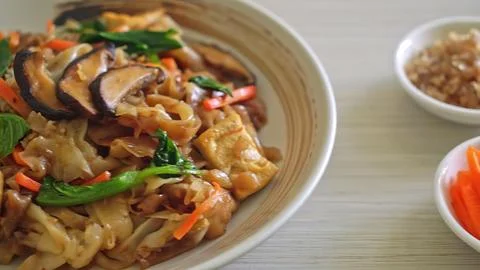 Stir-fried chicken with vegetables on a white plate Stock Photos