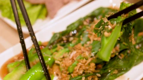 Stir-Fried Chinese Broccoli with Garlic and Oyster Sauce Stock Footage 345012715