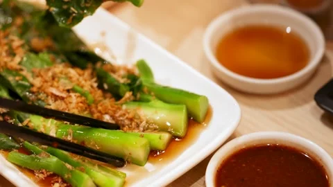 Stir Fried Chinese Broccoli with Garlic and Oyster Sauce Stock Footage 345013531