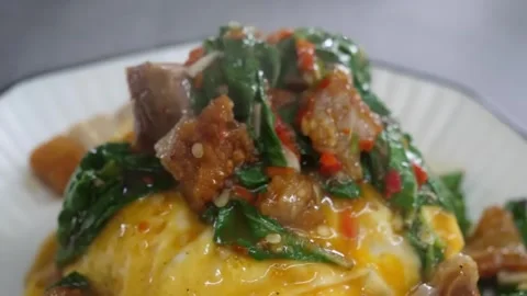 Stir-fried Crispy Pork Belly with Holy Basil (Pad Kra Pao Moo Krob) served over Stock Footage 338211881