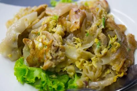 Stir fried flat noodle and chicken and egg Thai street food Stock Photos