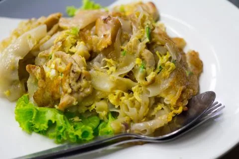 Stir fried flat noodle and chicken and egg Thai street food Stock Photos