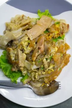 Stir fried flat noodle and chicken and egg Thai street food Stock Photos