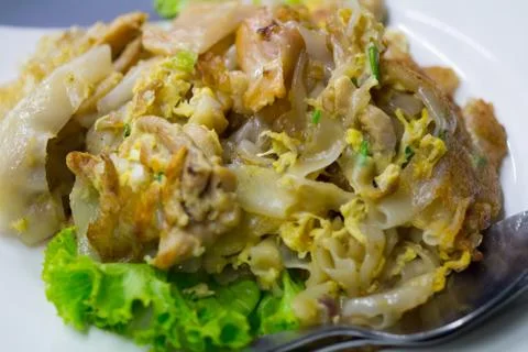 Stir fried flat noodle and chicken and egg Thai street food Stock Photos