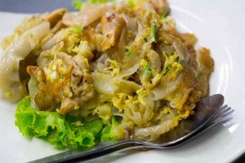 Stir fried flat noodle and chicken and egg Thai street food Stock Photos