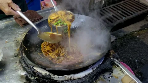 Stir fried flat rice noodle, popular Chinese street food in Penang, Malaysia. Stock Footage 237909347