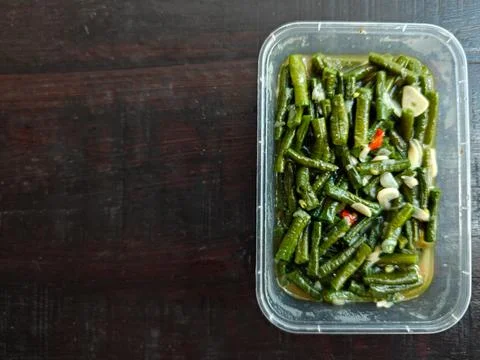 Stir Fried Long Beans with Garlic and Chili in Plastic Container Top View Stock Photos